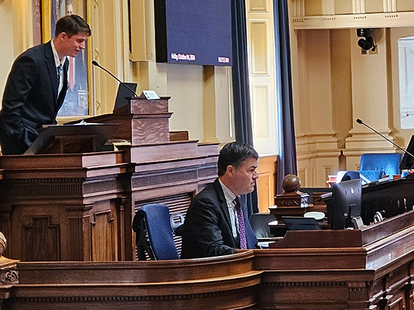 A student speaks from the podium in the Virginia State Capitol chambers